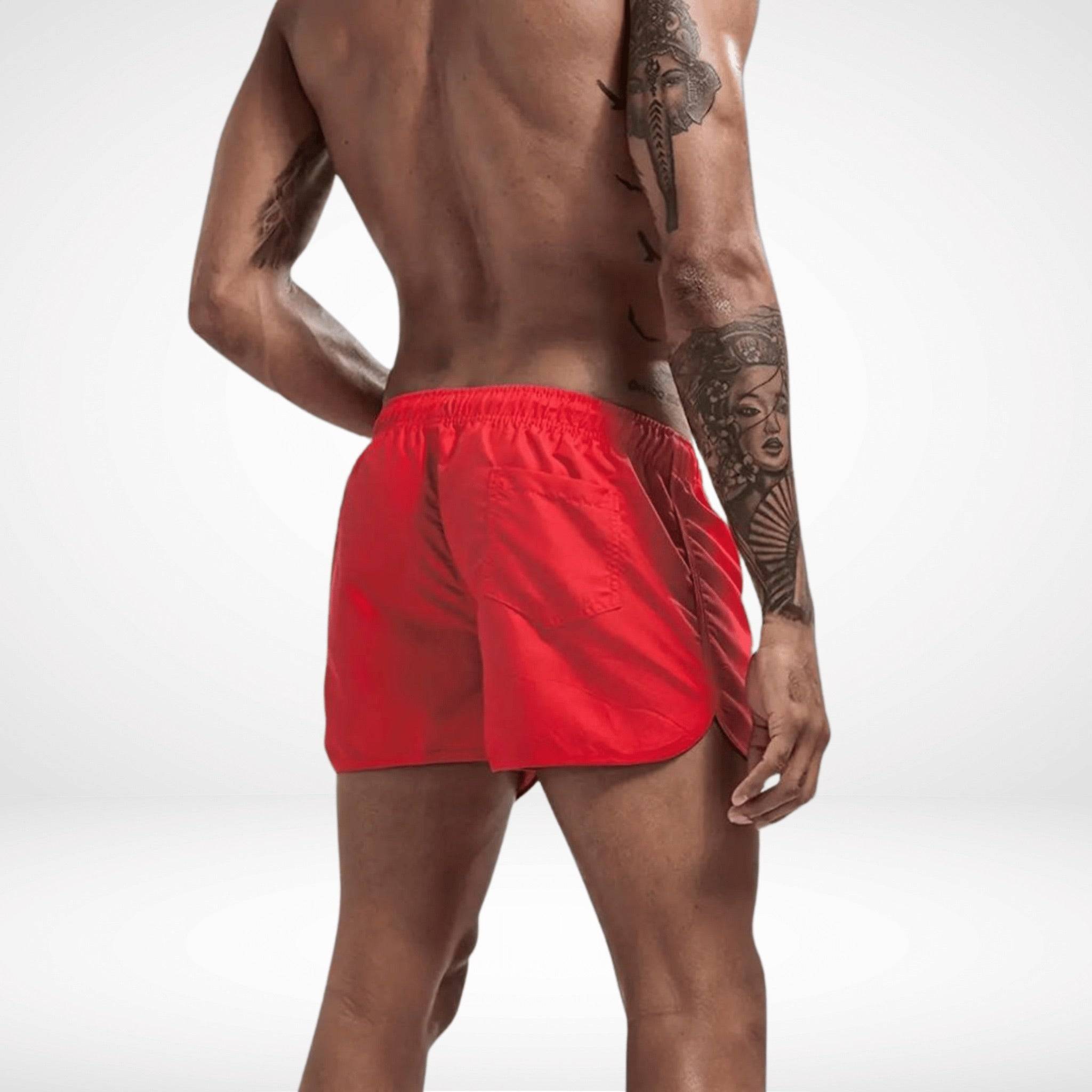 Rear view of red Classic Short Shorts with elastic waistband and back pocket, offering a sporty and stylish beachwear look.