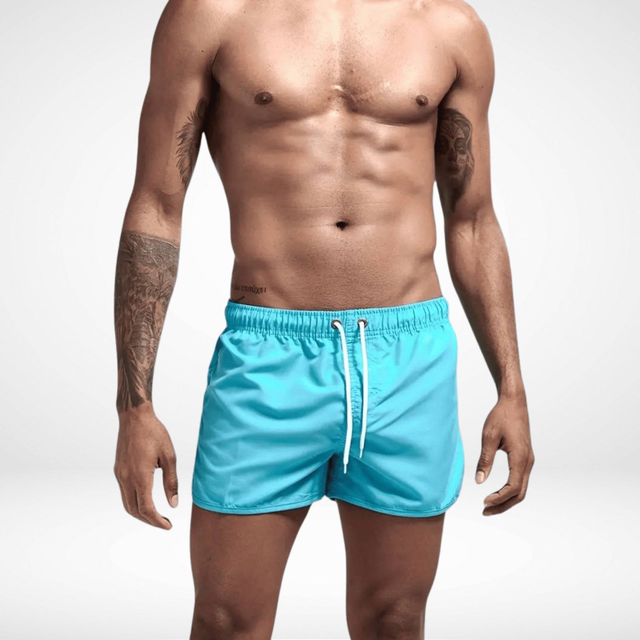 Classic Short Shorts – Men's Short Inseam, Quick-Dry Fit in aqua blue with drawstring waist, ideal for summer swimwear or beachwear.
