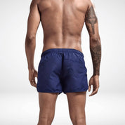 Back view of navy Classic Short Shorts with rear pocket and elastic waistband, combining function and sleek summer style.