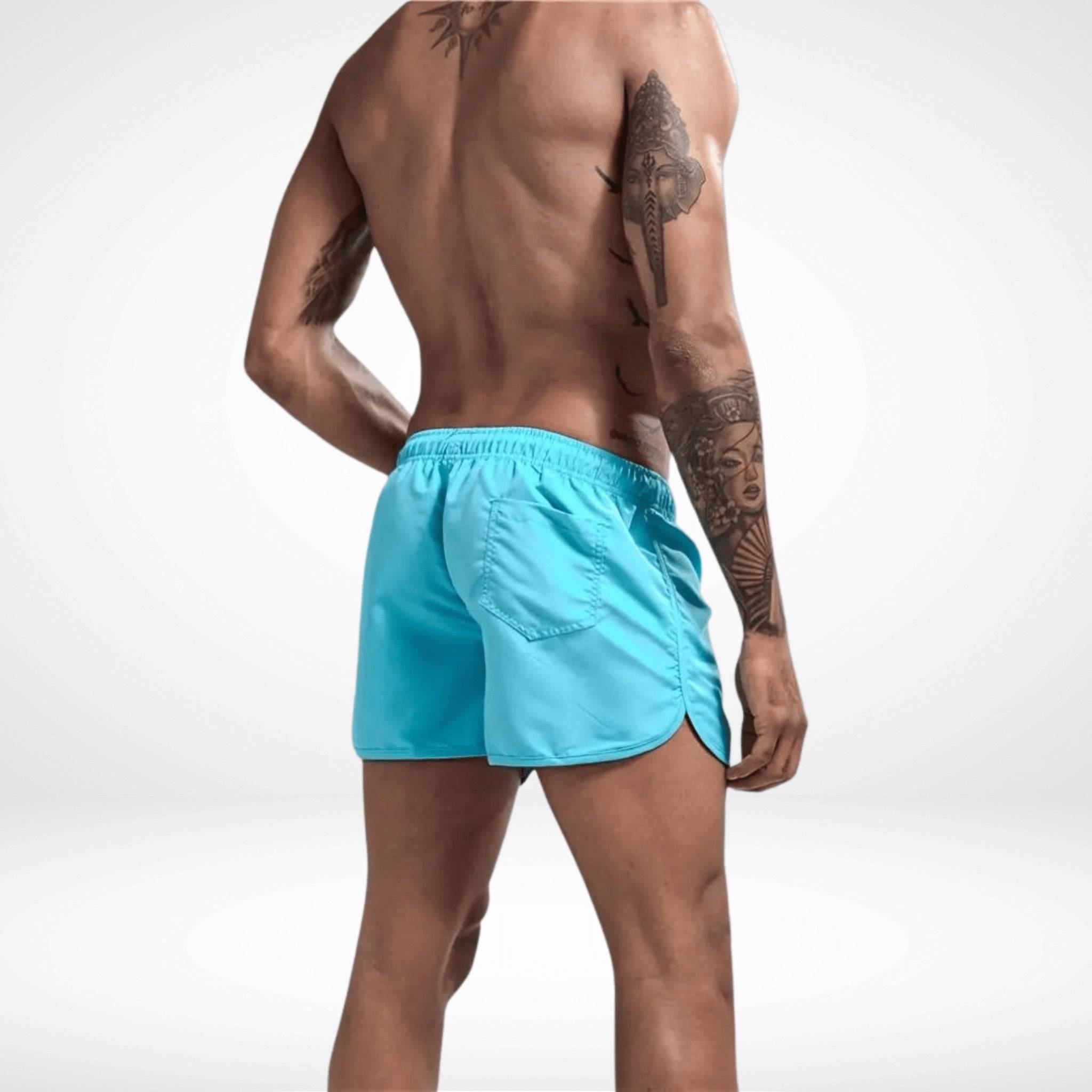 Back view of Classic Short Shorts in aqua blue, featuring a single rear pocket and curved hem for comfort and mobility.