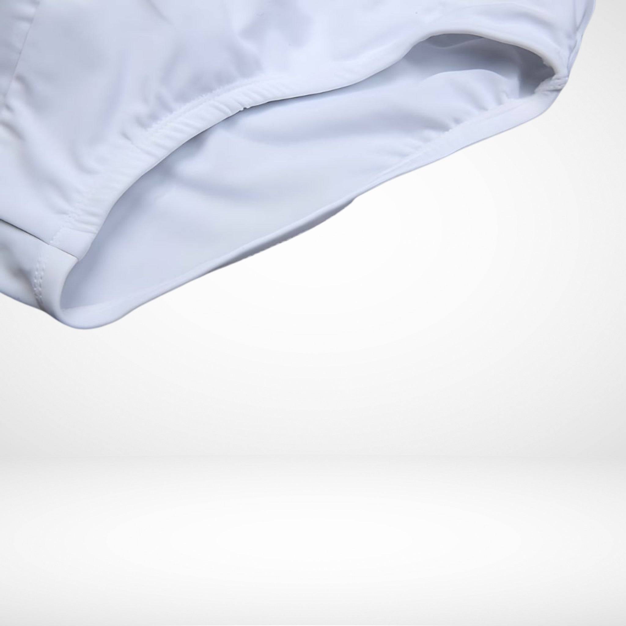 Detail view of EnhanceFit Swim Briefs in white showing inner lining and breathable material for enhanced water performance.