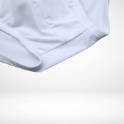 Close-up of EnhanceFit Swim Briefs in white highlighting soft quick-dry fabric and elastic leg openings for a secure fit.