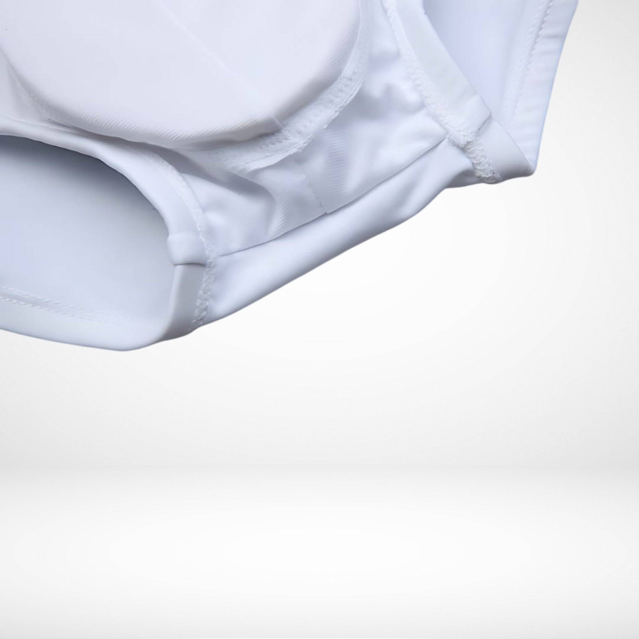 Close-up of EnhanceFit Swim Briefs in white showing removable padded pouch and reinforced stitching for comfort and support.