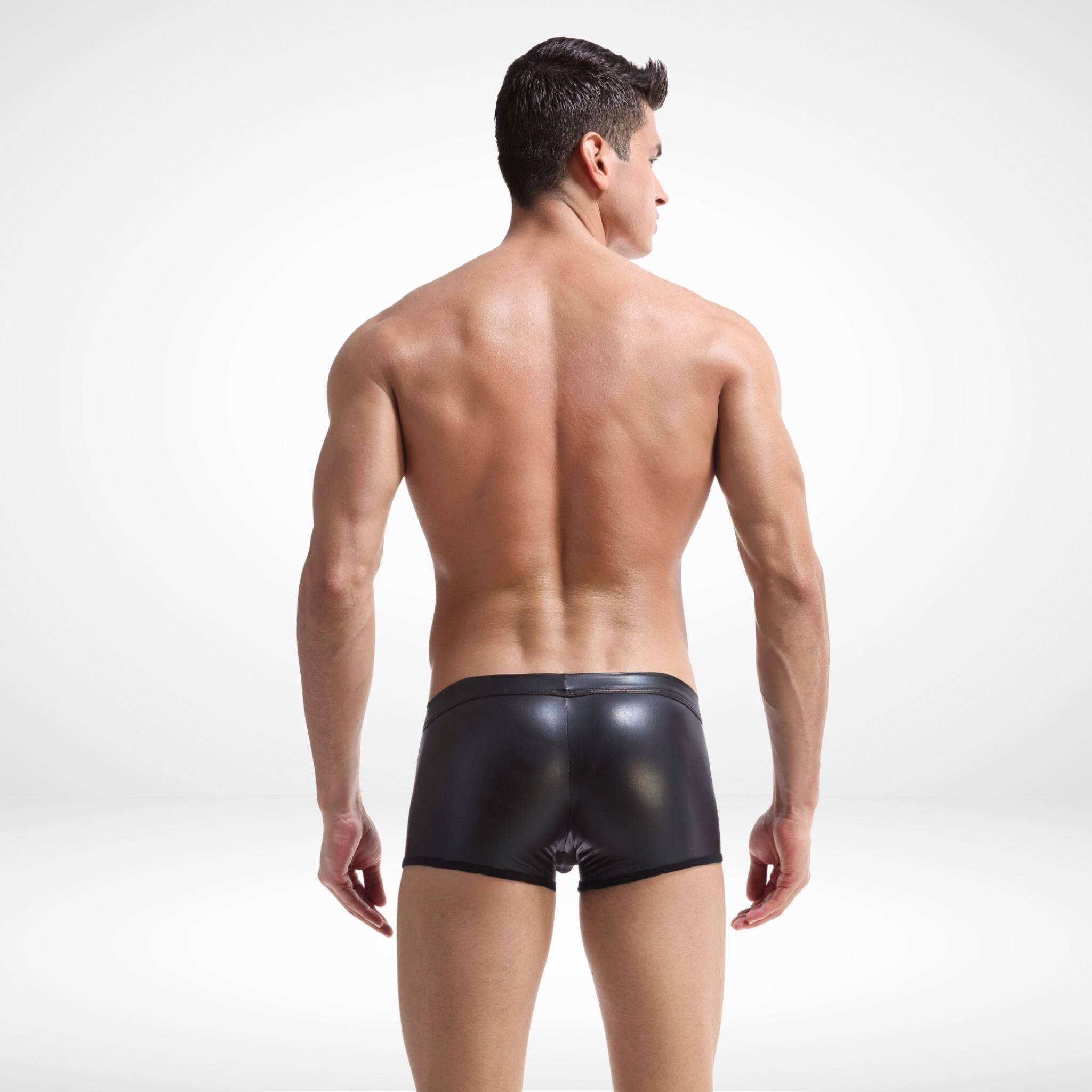 Back view of sheer front faux leather boxer briefs showing smooth, glossy black finish and snug fit for fashionable men's underwear.