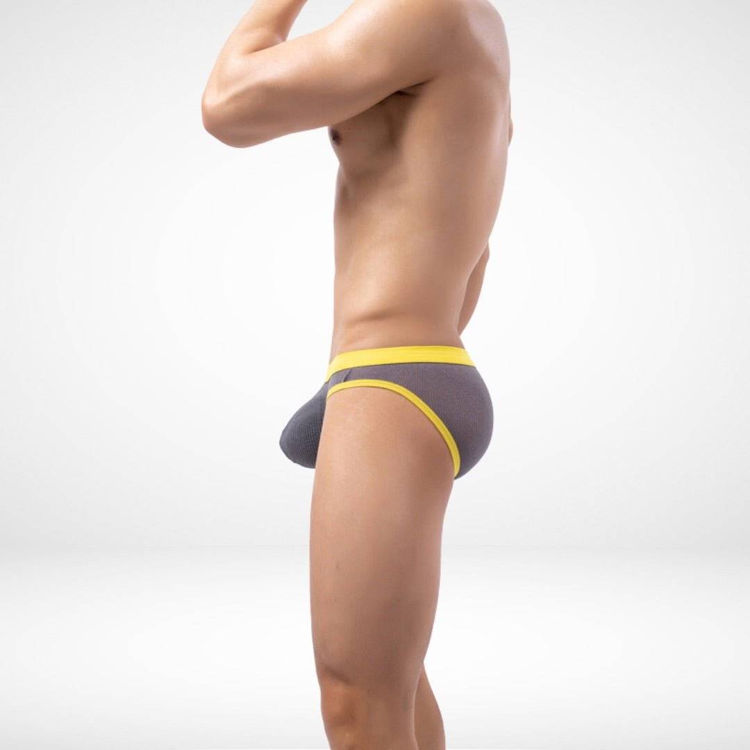 Side view of gray sheer mesh briefs with yellow trim, offering a snug, stretchable fit for men's daily wear.