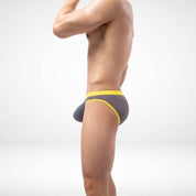 Side view of gray sheer mesh briefs with yellow trim, offering a snug, stretchable fit for men's daily wear.