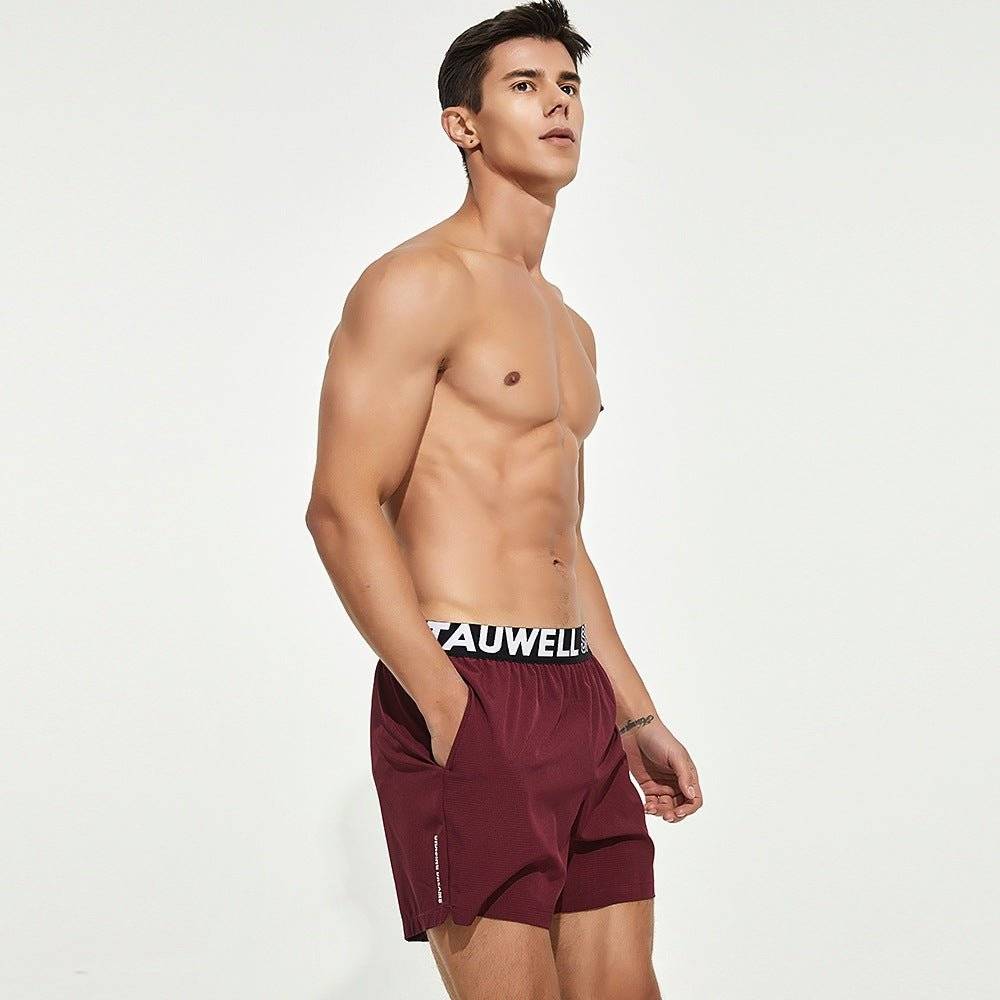 Maroon men's lined gym training shorts with a Tauwell branded waistband, displayed in a side pose for activewear versatility.