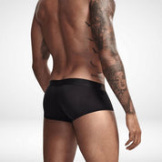 Black transparent ice silk boxer briefs shown from rear on male model. Smooth, breathable fabric with snug fit for everyday wear.