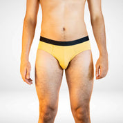 Front view of Soft Modal Comfort Fit Men's Briefs in mustard yellow, featuring soft fabric and flexible waistband.