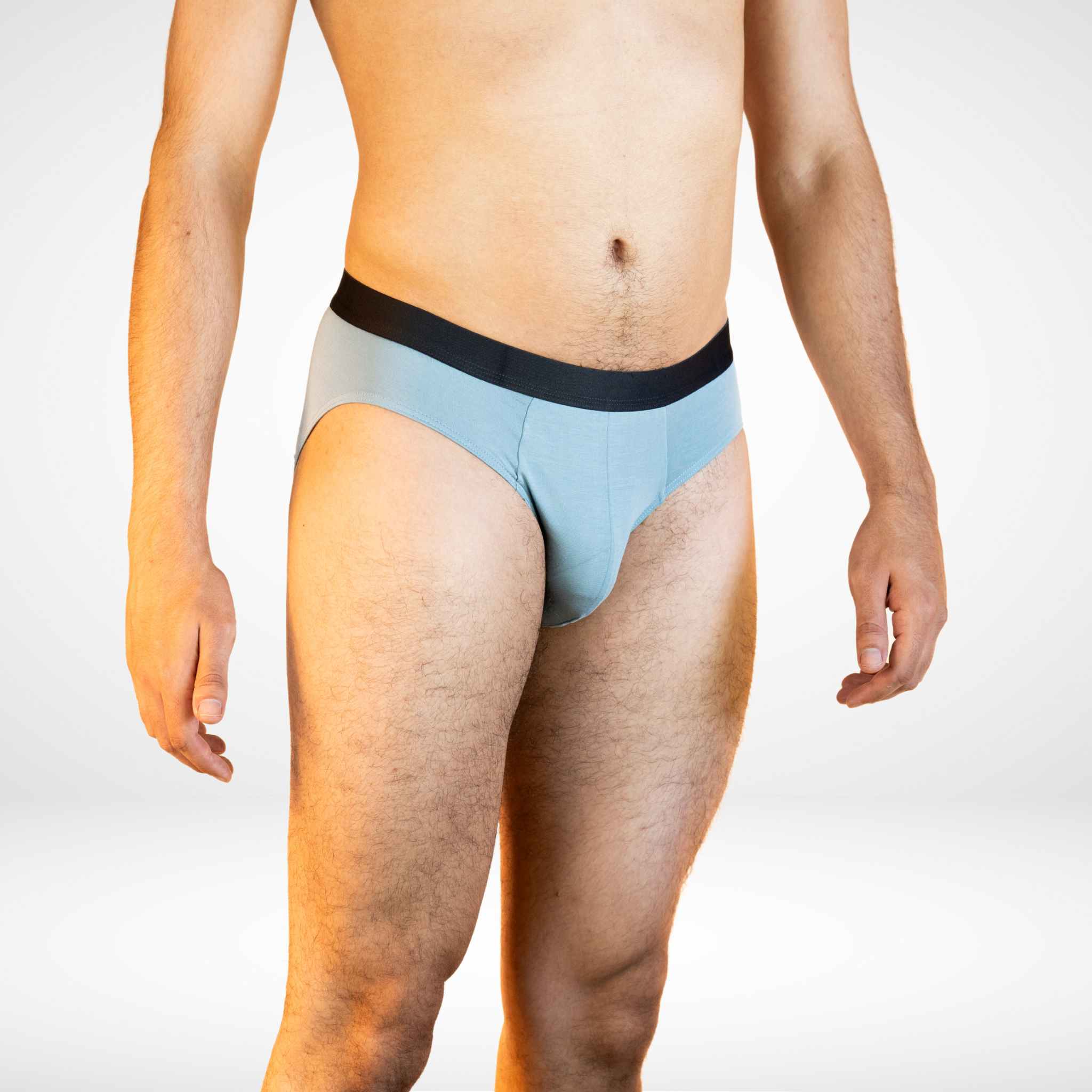 Side view of Soft Modal Comfort Fit Men's Briefs in light blue, designed for breathable comfort and flexible fit.