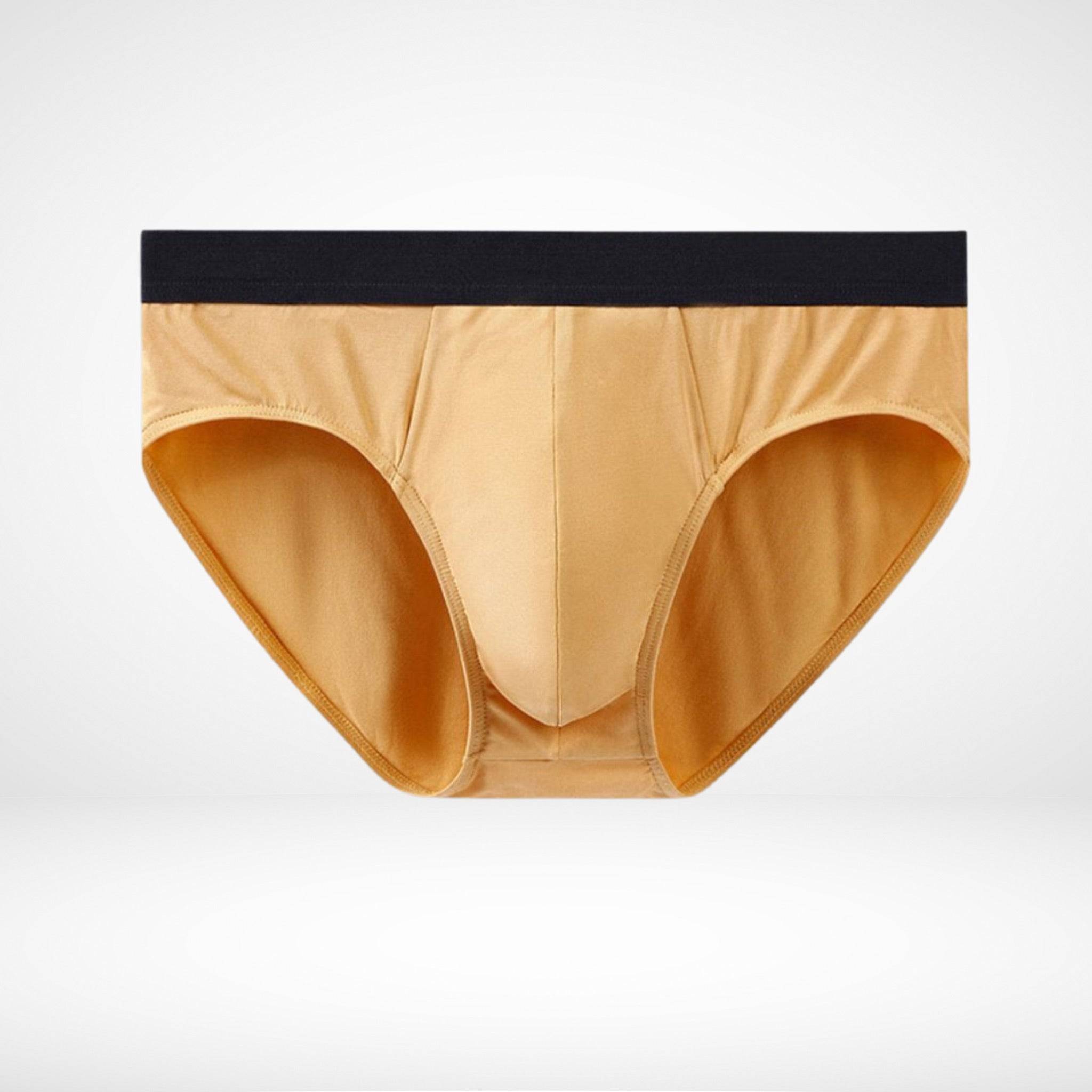 Flat lay of mustard yellow Soft Modal Comfort Fit Men's Briefs with black waistband, perfect for everyday wear.