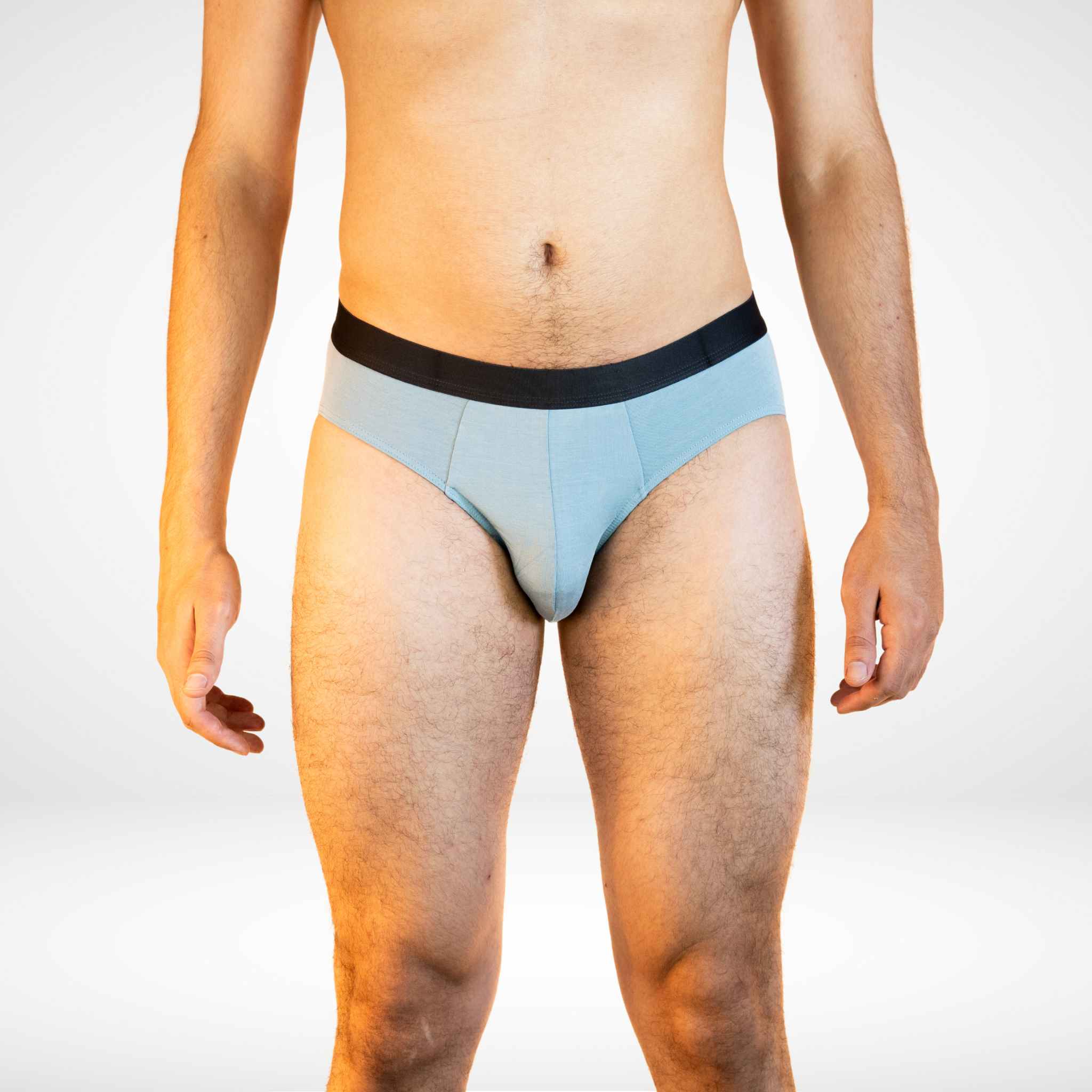 Soft Modal Comfort Fit Men's Briefs in light blue with black waistband, offering moisture-wicking and stretch for everyday wear.