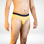 Side view of Soft Modal Comfort Fit Men's Briefs in mustard yellow, designed for breathable and stretchable comfort.