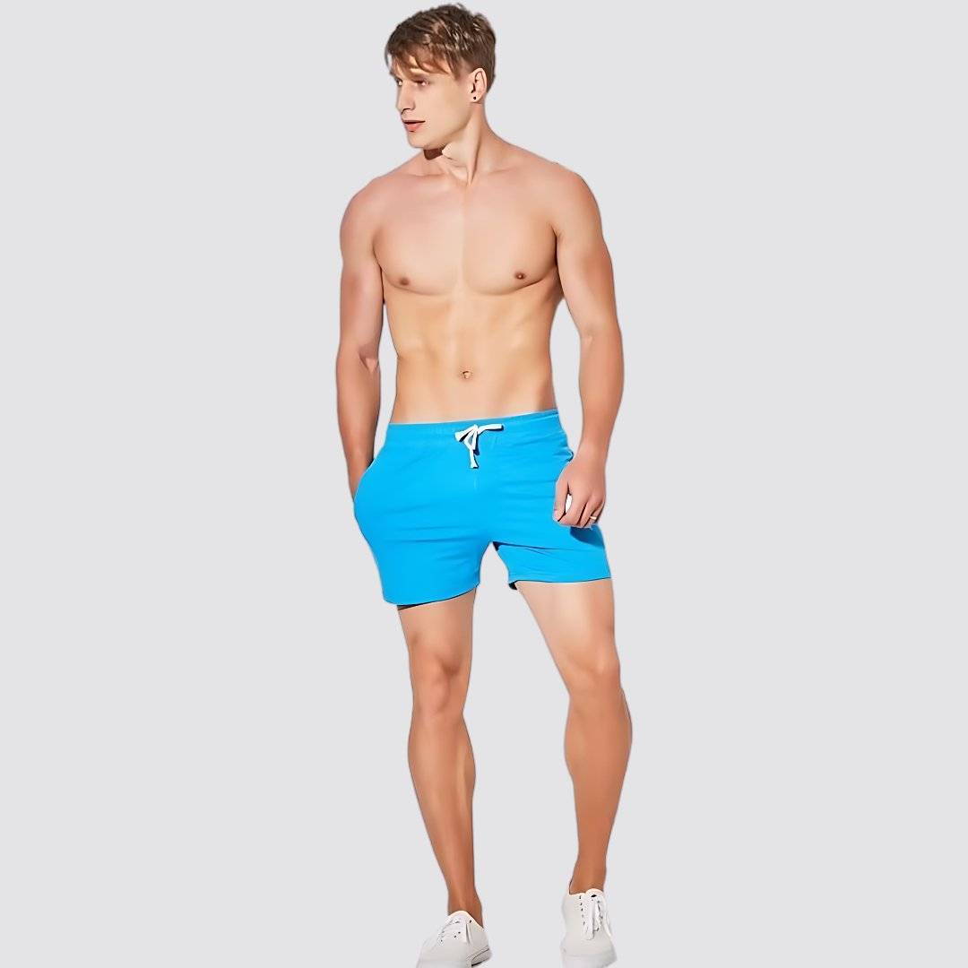UrbanFit Basics Everyday Shorts in bright blue, featuring stretch cotton blend, drawstring waist, and side pockets for casual comfort.