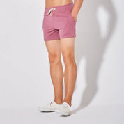 Front view of UrbanFit Basics Everyday Shorts in dusty rose, designed with a drawstring waist and soft cotton blend.