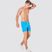 Men's UrbanFit Basics Everyday Shorts in blue shown in motion, designed for flexibility and everyday wear with a modern athletic fit.