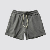Flat lay of UrbanFit Basics Everyday Shorts in charcoal grey, designed with soft cotton blend and side pockets for comfort.