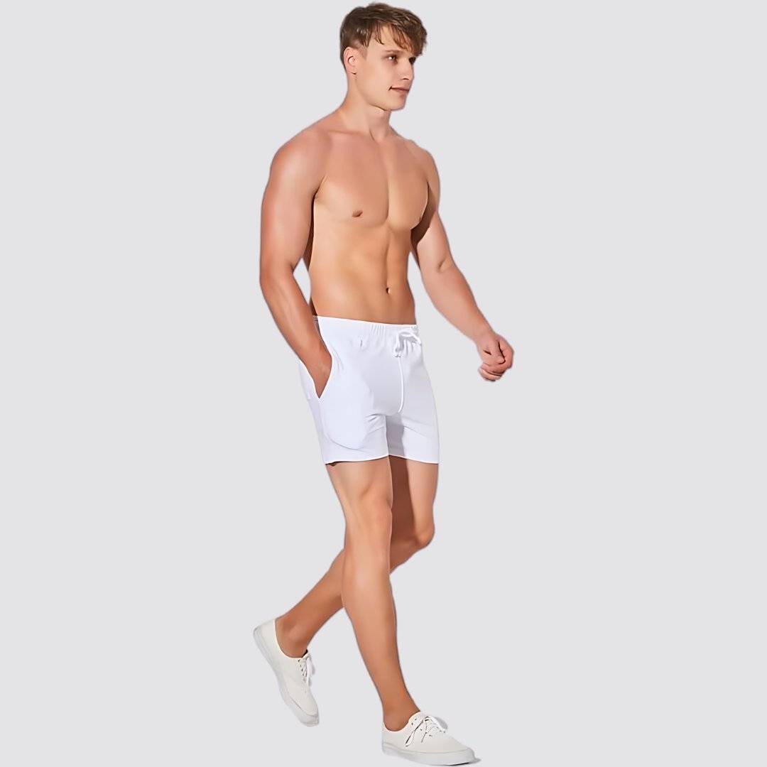 Side view of UrbanFit Basics Everyday Shorts in white, designed for comfort and movement with a slim fit and soft cotton blend.