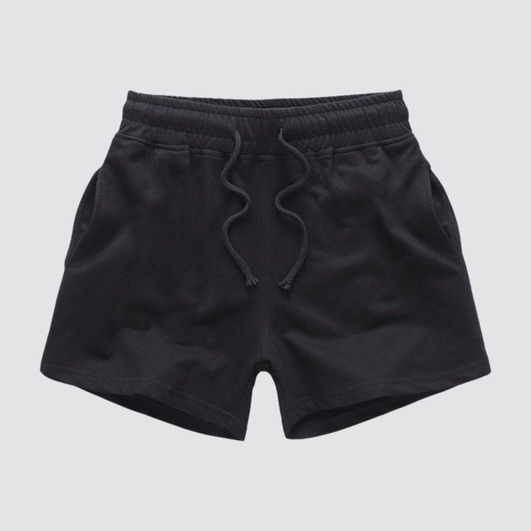 Flat lay of UrbanFit Basics Everyday Shorts in black with drawstring waist and side pockets, crafted for comfort and durability.